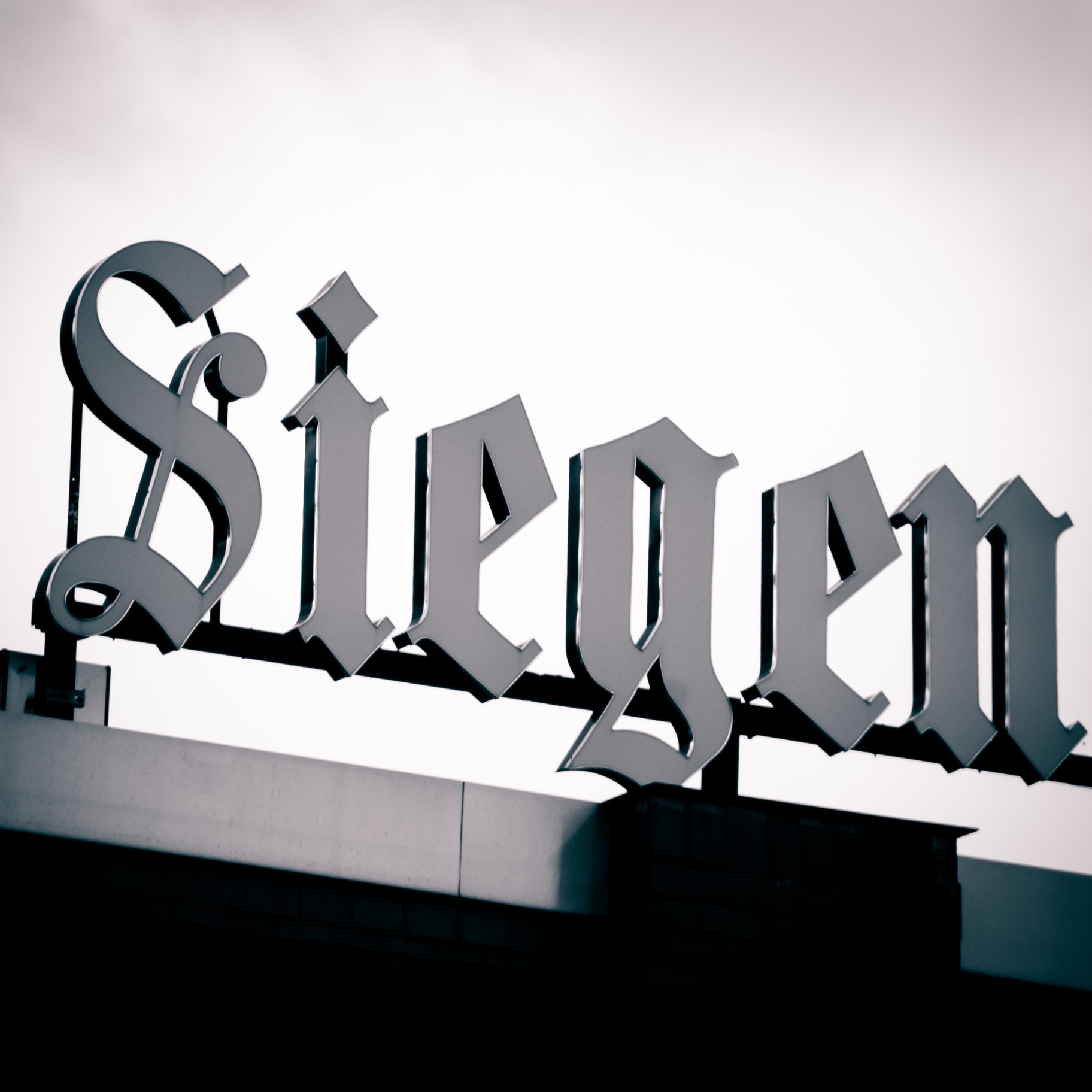 Siegen auf Holz - Schriftzug